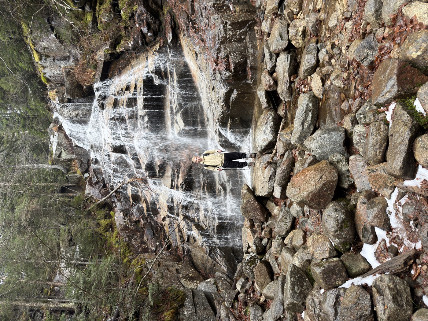Caleb Standing at Waterfall